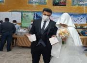 عکس/ حضور عروس و داماد کرجی پای صندوق رای