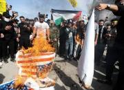 عراقی‌ها پرچم‌های آمریکا و رژیم صهیونیستی را به آتش کشیدند