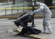 عکس/ برداشتن جسد یک زن کرونایی از خیابان